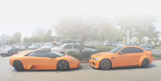 Orange Ferrari and BMW 